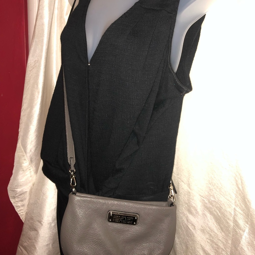 This is a medium gray tinted purse.